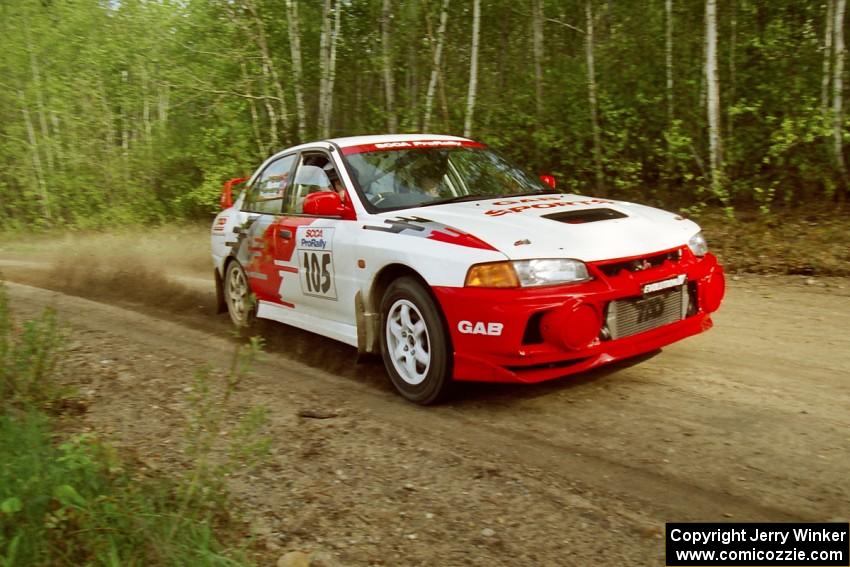 Bill Morton / Mike Busalacchi at speed in the Two Inlets State Forest in their Mitsubishi Lancer Evo IV.