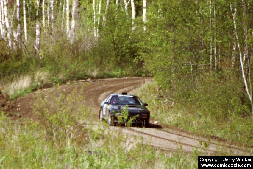 Dave Hintz / Doug Chase at speed in their Mazda RX-7 in the Two Inlets State Forest.