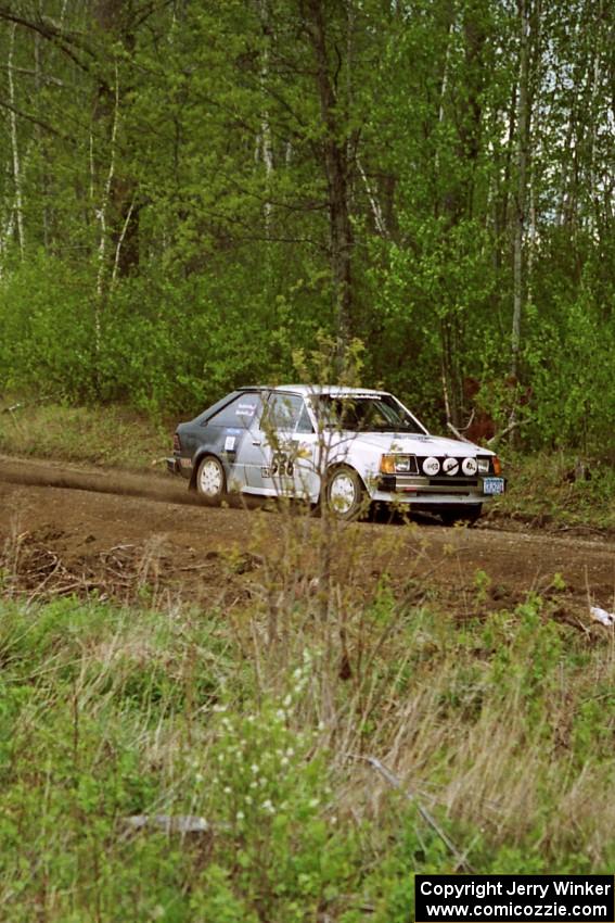 Jim Buchwitz / C.O. Rudstrom at speed in their Ford Escort in the Two Inlets State Forest.