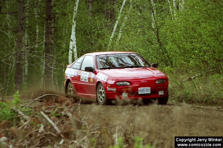 Jouni Pohjolainen / John Matikainen in their Nissan NX2000 in the Two Inlets State Forest.