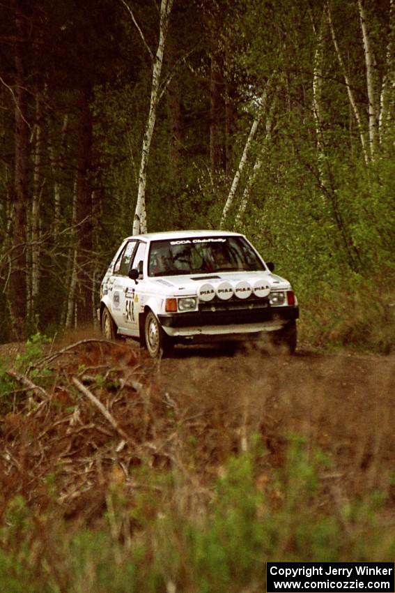 John Zoerner / John Shepski at speed in their Dodge Omni GLH-Turbo through the Two Inlets State Forest.