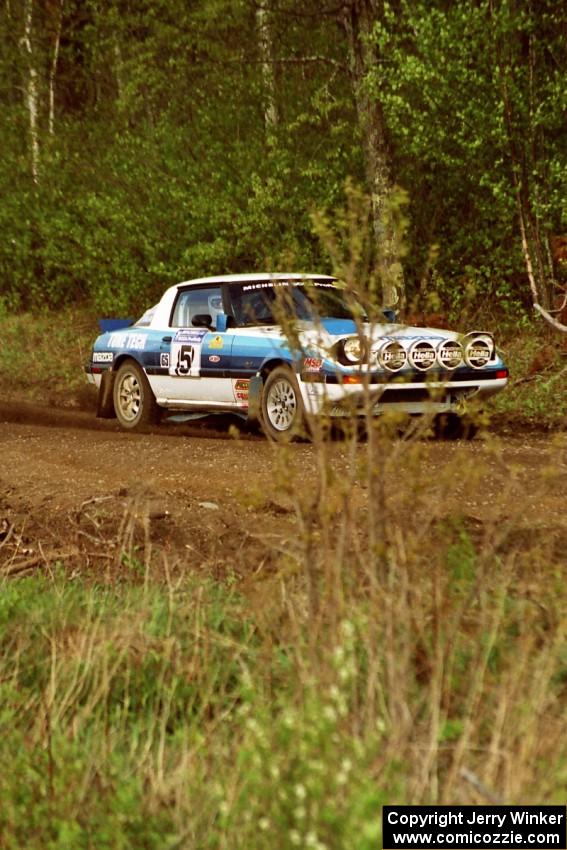 The Doug Dill / Dave Fuss Mazda RX-7 at speed in the Two Inlets State Forest.