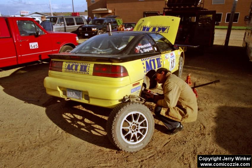 Mark Strohm checks brakewear on the Steve Gingras / Bill Westrick Eagle Talon.