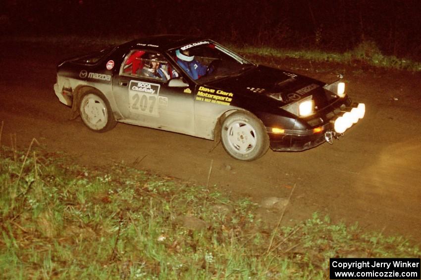 Dave Hintz / Doug Chase in their Mazda RX-7 at the crossroads spectator area.