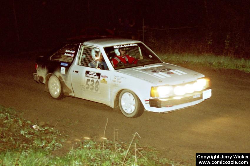 Jim Buchwitz / C.O. Rudstrom at speed in their Ford Escort at the crossroads spectator point.