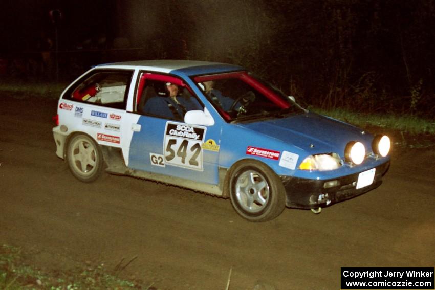 Dan Moore / John Hopponen at speed in their Suzuki Swift GTi at the crossroads.