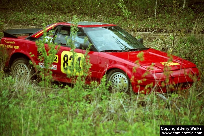 The Randy Bailey / Will Perry Toyota MR-2 off in the weeds tring to get back on the road.