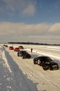 The field lines up in pit lane for the start of a Saturday sprint race.