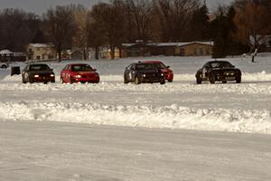 The field lines up for the green flag to drop at the start of a sprint race.