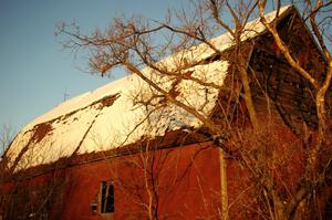 An old barn to the south of Rush City at sunset.