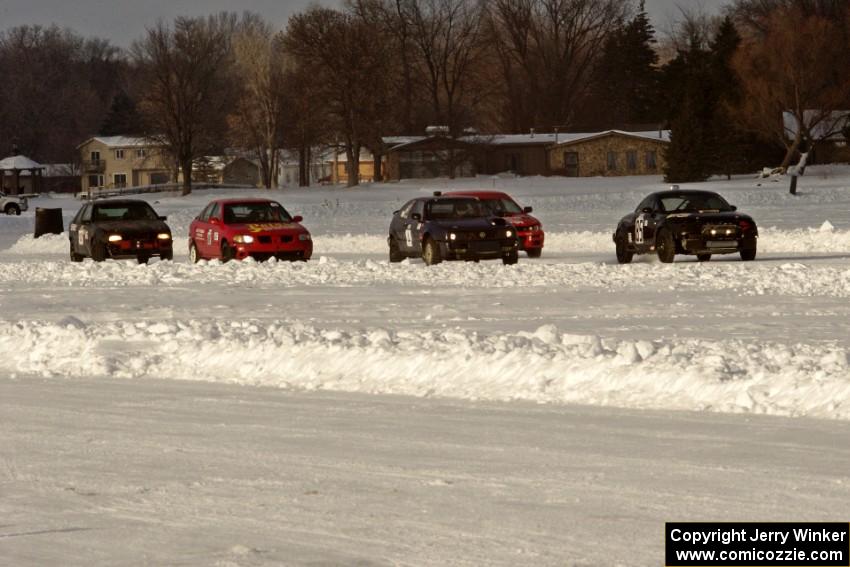 The field lines up for the green flag to drop at the start of a sprint race.