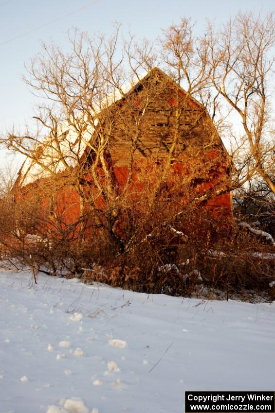 An old barn to the south of Rush City at sunset.