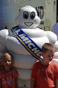 Kids posing with the Michelin man