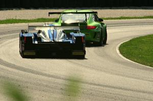 Tony Burgess / Michael Marsal / Eric Lux Lola B11/66 Mazda chases one of the Green Hornet Posche GT3 Cups in the carousel