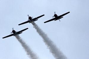 WWII trainer planes fly overhead before the race's start.