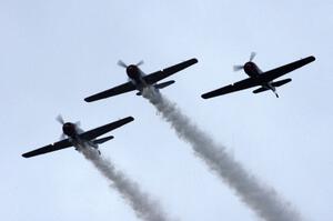 WWII trainer planes fly overhead before the race's start.