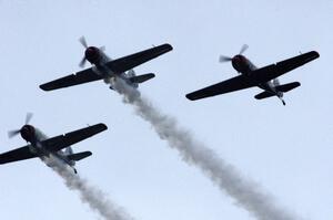 WWII trainer planes fly overhead before the race's start.