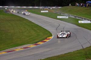 The field streams into turns six and seven on the first lap.