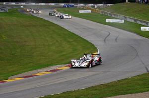 The field streams into turns six and seven on the first lap.