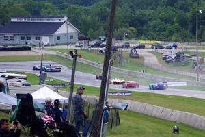 A large group of PC and GT cars dive into turn 8 on the first lap