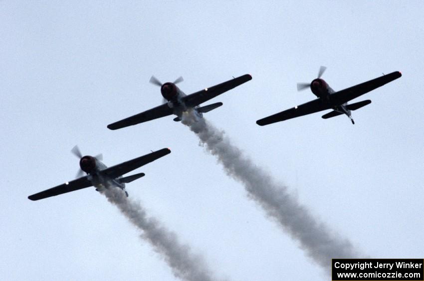 WWII trainer planes fly overhead before the race's start.