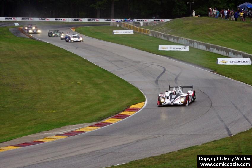 The field streams into turns six and seven on the first lap.