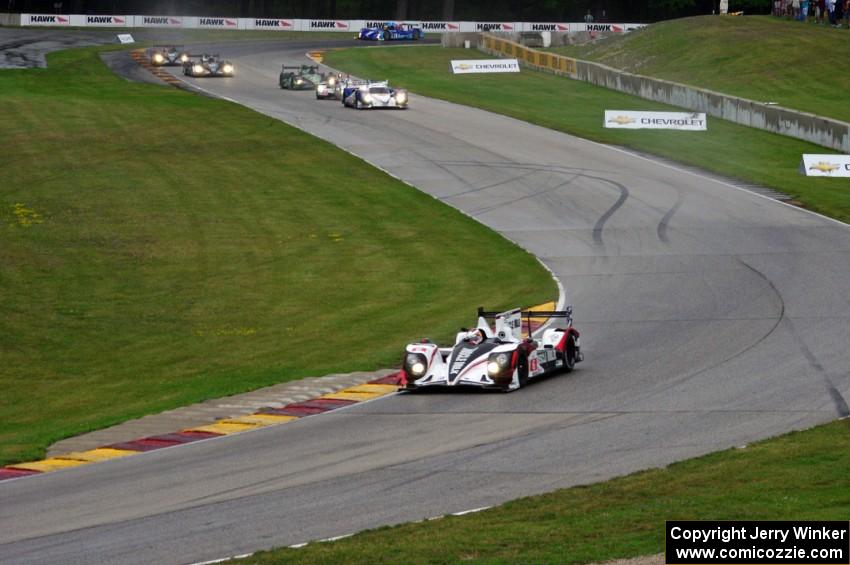 The field streams into turns six and seven on the first lap.