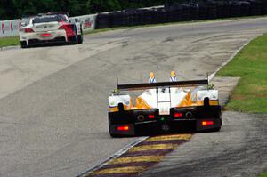 Mirco Schultis / Renger van der Zande Oreca FLM09 chases the John Edwards / Dirk Müller BMW Z4 GTE