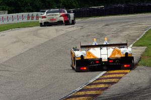 Mirco Schultis / Renger van der Zande Oreca FLM09 chases the John Edwards / Dirk Müller BMW Z4 GTE
