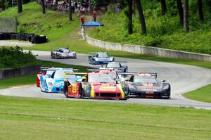 The field streams out of turn 12 into 13 on the pace lap.