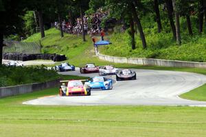 The field streams out of turn 12 into 13 on the first lap.