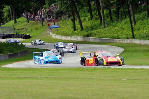 The field streams out of turn 12 into 13 on the first lap.