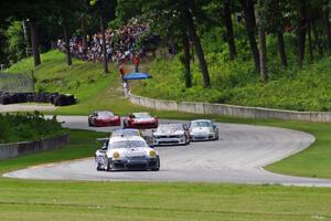 GT cars stream through turns 12 and 13 on the first lap.