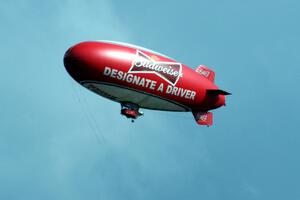 The Budweiser blimp flying overhead.