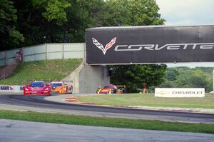 Jon Fogarty / Alex Gurney Chevy Corvette DP (Riley) leads the field into turn 6.