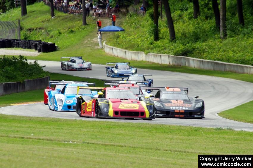 The field streams out of turn 12 into 13 on the pace lap.