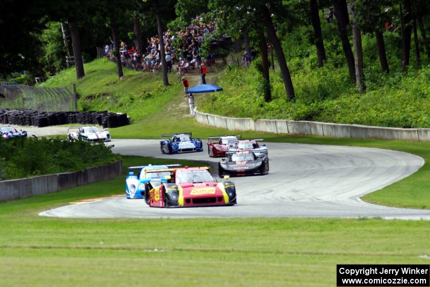 The field streams out of turn 12 into 13 on the first lap.