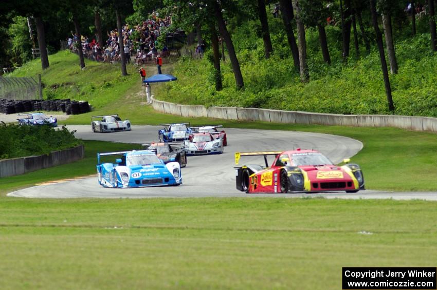 The field streams out of turn 12 into 13 on the first lap.