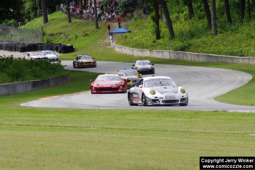 GT cars stream through turns 12 and 13 on the first lap.