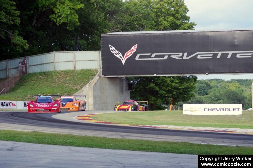 Jon Fogarty / Alex Gurney Chevy Corvette DP (Riley) leads the field into turn 6.