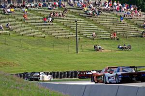 Several front-runners at turn 7 near the midpoint of the race.