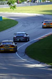 Bill Auberlen / Paul Dalla Lana / Billy Johnson BMW M3 and Patrick Lindsey / Patrick Long Porsche GT3 Cup battle in GT class