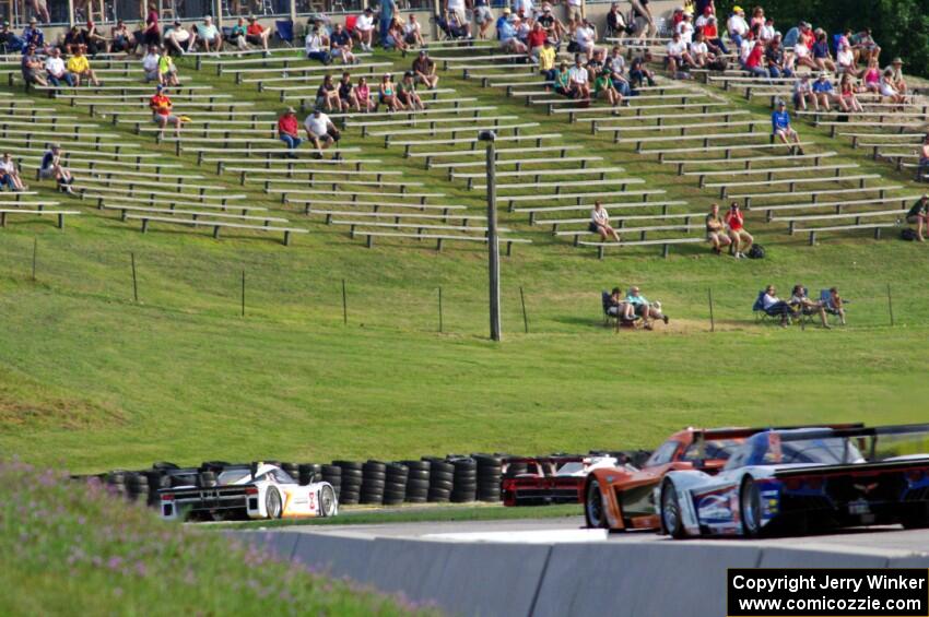 Several front-runners at turn 7 near the midpoint of the race.