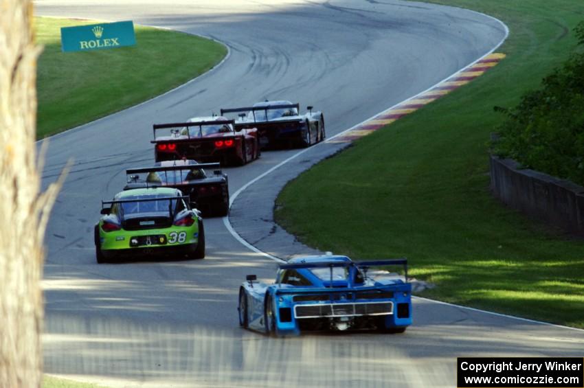 A stream of cars heads out of Canda Corner.