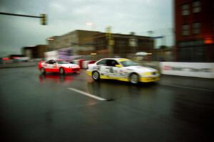 Hugh Plumb's BMW 328is and Michael Galati's Acura Integra Type R battle in the rain