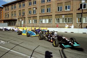 The front of the field comes through turn 9 on the first lap.