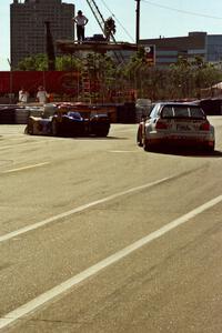 Ross Bentley / Mark Simo BMW M3 follows the Scott Schubot / Henry Camferdam Riley & Scott Mk. III/Ford