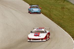 Andy McNeil / Doug Mills / Kerry Hitt Chevy Camaro and Jennifer Tumminelli / Steve Ariana /Ludovico Manfredi Porsche 911 Carrera