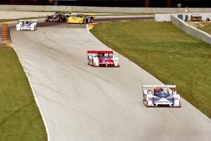 The front-runners start passing the SRII cars and are still bunched together between turns 6 and 7.