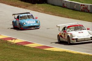 Jack Lewis / Karl McKeever Porsche 911 Carrera RSR and Jennifer Tumminelli / Steve Ariana / Ludovico Manfredi Porsche 911 Carrer